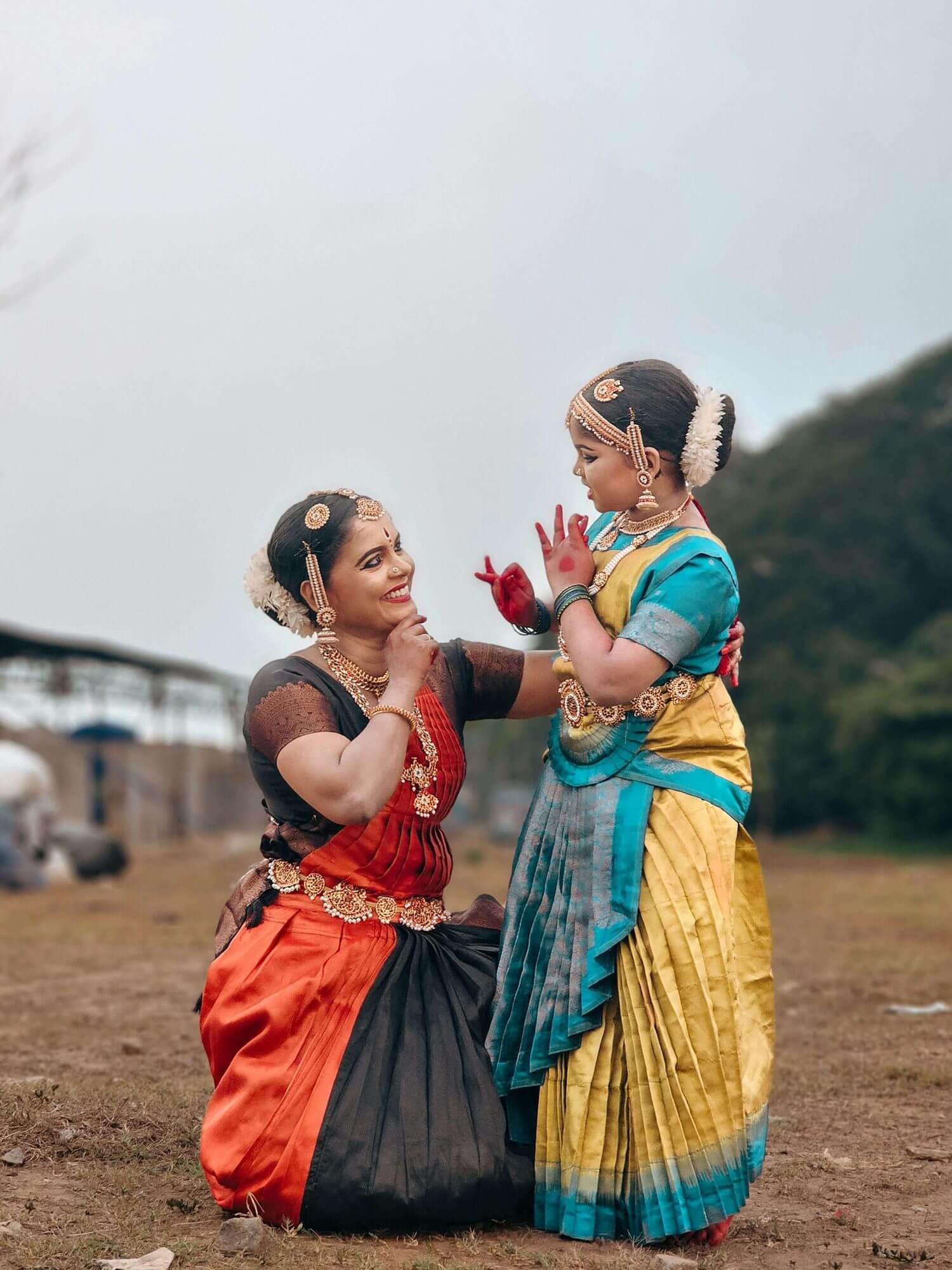 Two dancers in a seated pose